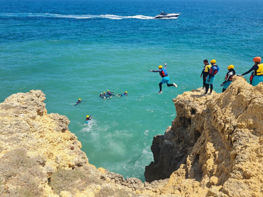 Albufeira: Guided Coasteering Tour with Cliff Jumping - Walking, swimming, and entering the caves
