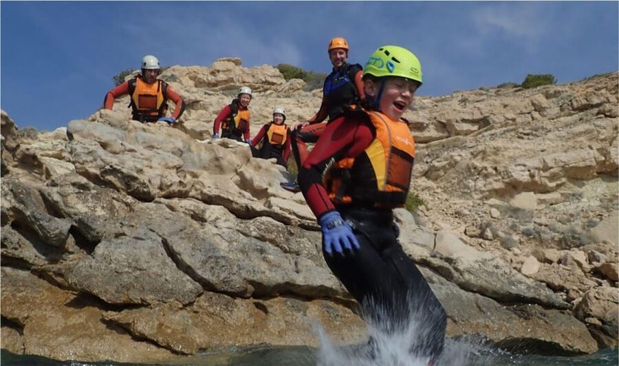 Alicante: Coasteering Adventure on Torres de la Villajoyosa - Swimming through caves and along the rocks