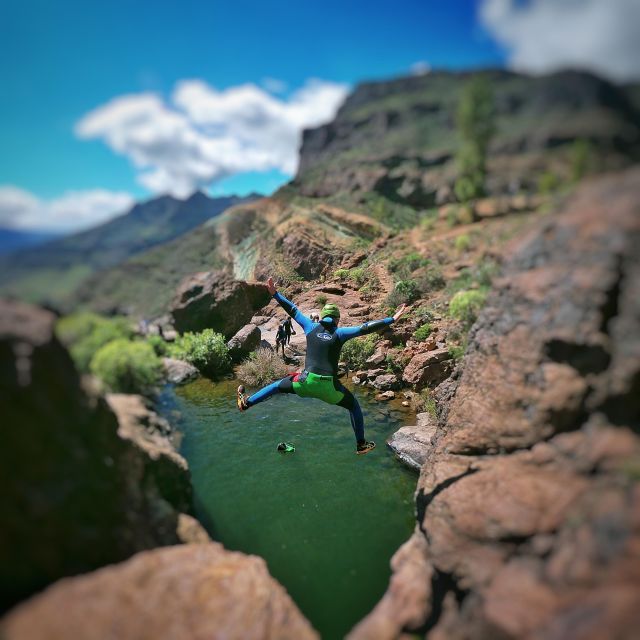 Canyoning in the Rainbow Mountain Gran Canaria - Entering the canyon: jumps, water, and natural slides