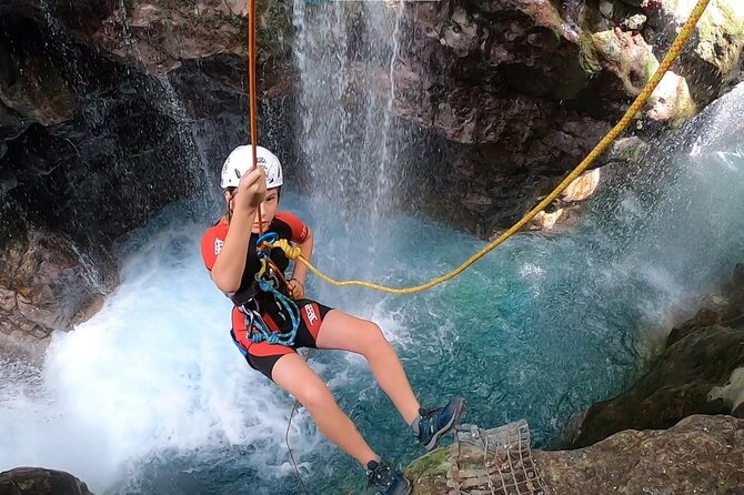 Canyoning in the water - Kourtaliotiko Gorge - Rappelling beside the waterfall