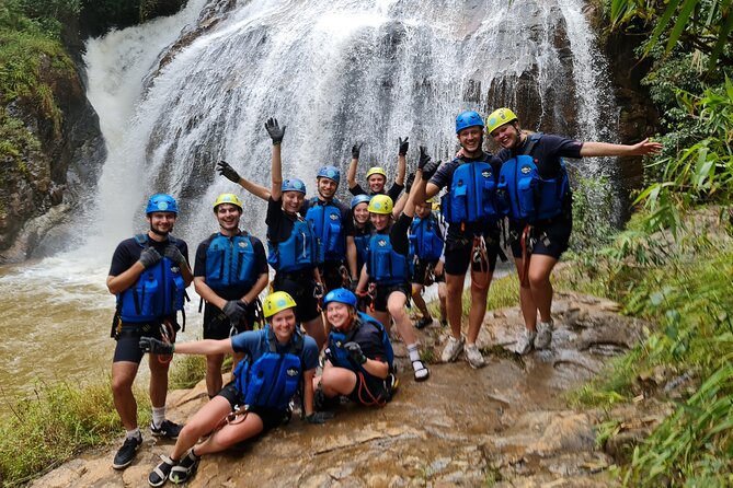 Canyoning Tour in Dalat Viet Nam - The first 18-meter rappel beside the waterfall