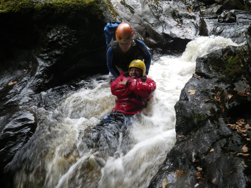 Join Splash White Water Rafting Canyoning Tour - Ninety minutes of slides, swims, and jumps