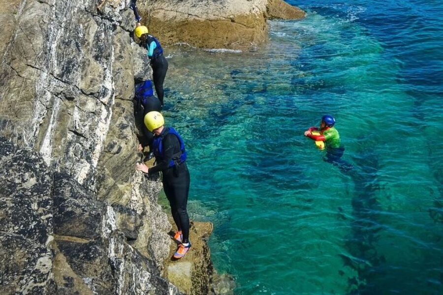 Newquay: Coasteering - Moving through caves, tunnels, and gullies
