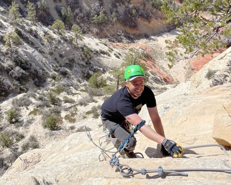 Orderville: Via Ferrata Guided Climbing and Rappelling Tour - Climbing the fixed-anchor route above the red rock