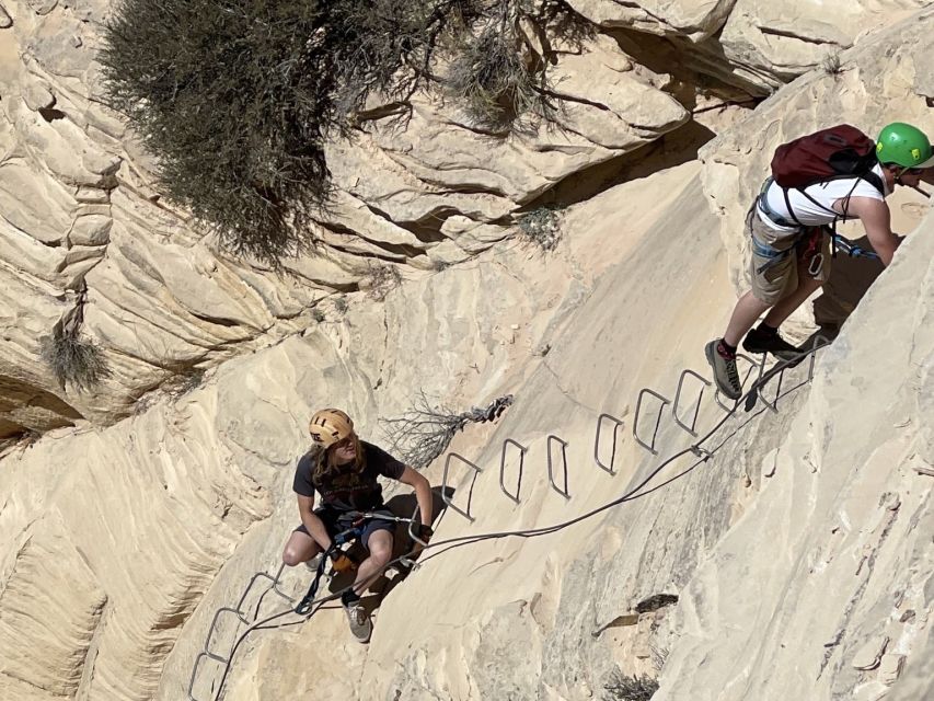 Orderville: Via Ferrata Guided Climbing and Rappelling Tour - Rappelling down a red and white cliff