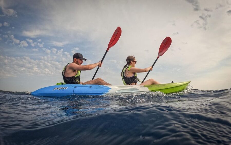 Pula: Kayaking,Snorkeling, Cliff jumping Tour with Wetsuit - Paddling toward the coastal stops