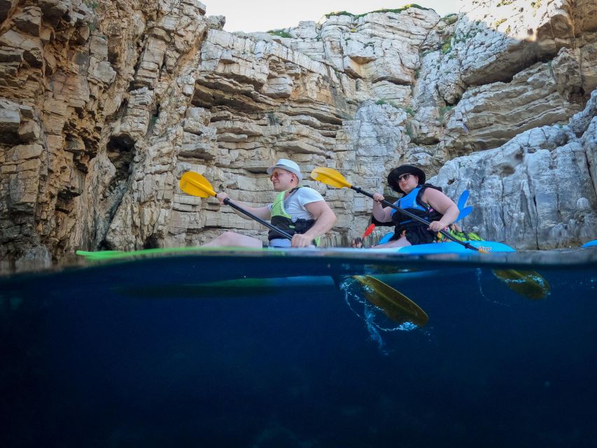 Pula: Kayaking,Snorkeling, Cliff jumping Tour with Wetsuit - Cliff jumping with a camera ready