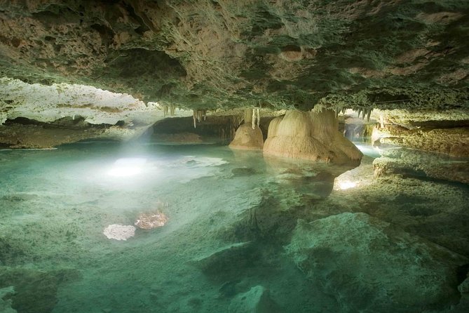 Tulum Adventure (archeological zone-Atv-ziplines-cenote-lunch-drinks-rappel) - Swimming through the cenote cavern